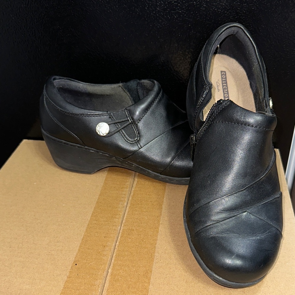 Clarks Black Leather Women's Mules with Silver Button